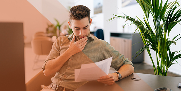 man looking on papers | hoa accounting