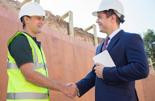 businessman shaking hands | property manager doing a good job