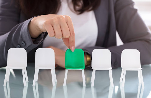 holding a green chair | consult an hoa management company