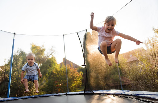 happy kids playing | hoa backyard rules