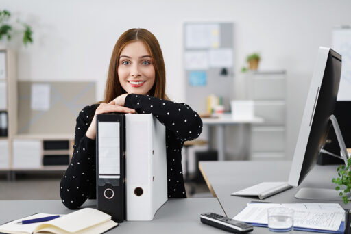 Woman with file and document binders | request HOA documents