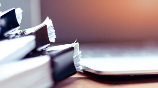 Stack of documents placed on a desk | request for hoa documents