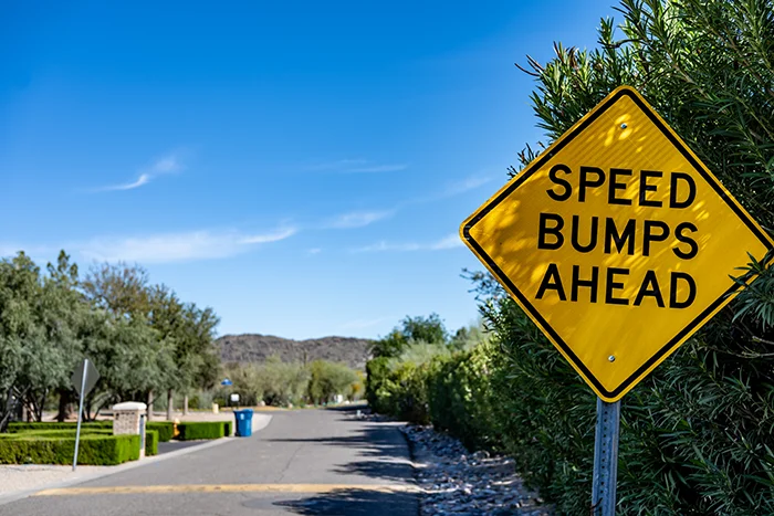 speed bump ahead sign | speed bumps in HOAs
